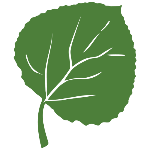 A wooden stamp rests on paper, leaving a black circular imprint with a leaf design and wavy textured lines inside the circle.